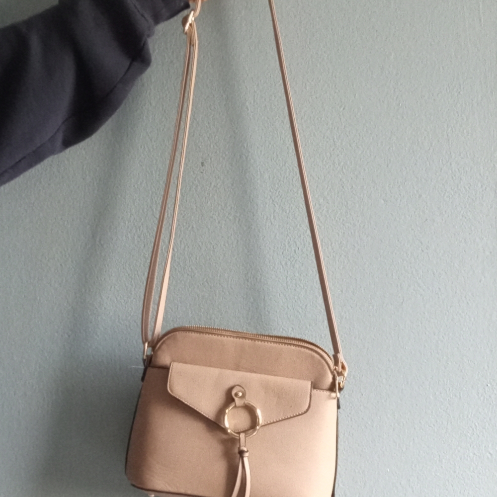 Tan Crossbody Bag with Tassel Detail and Adjustable Strap